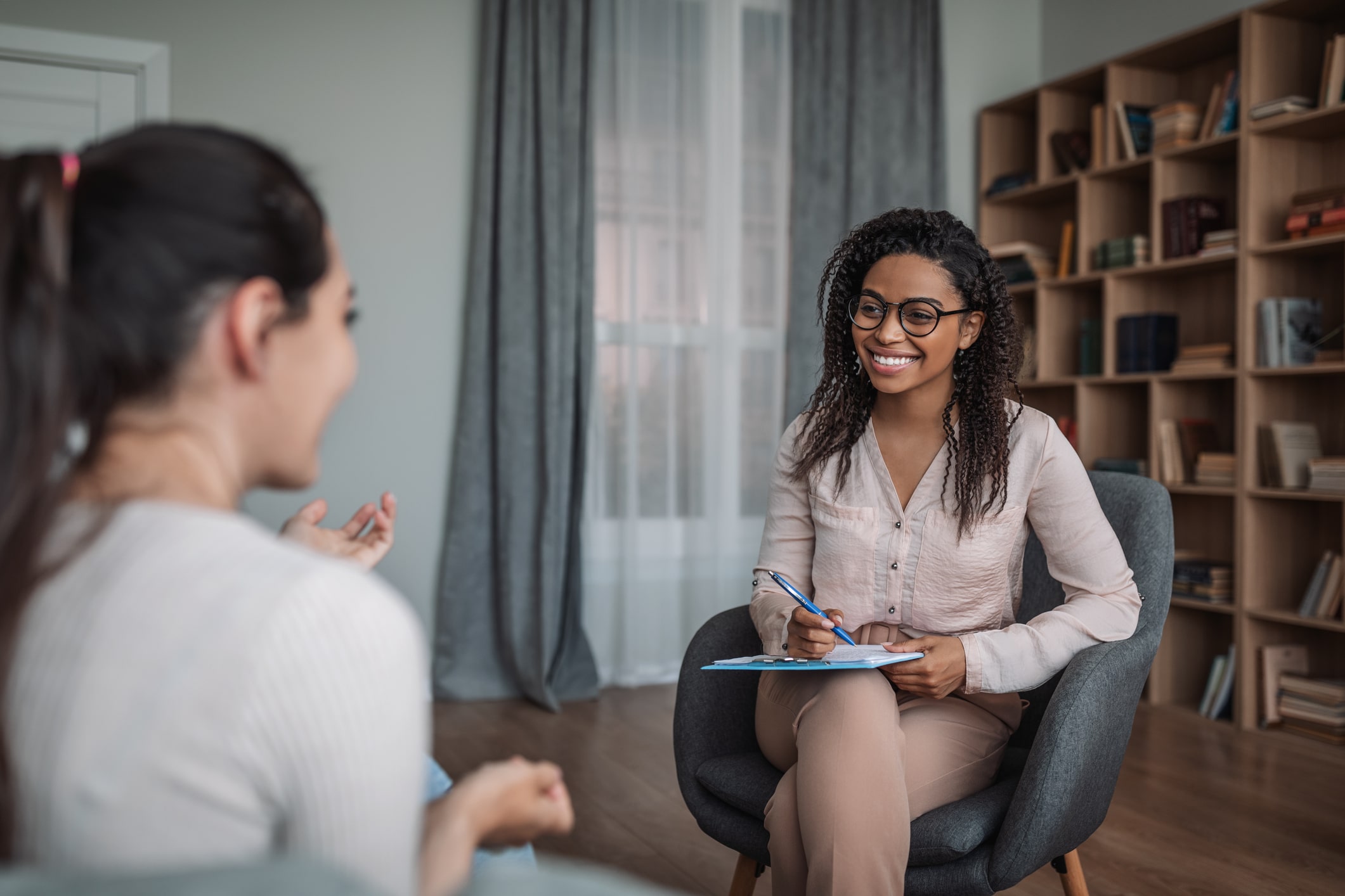 Counseling session featuring two women.