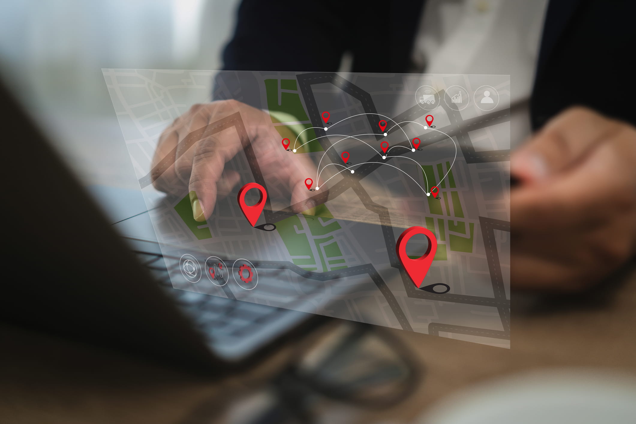 Person interacting with a navigation system on their laptop computer.