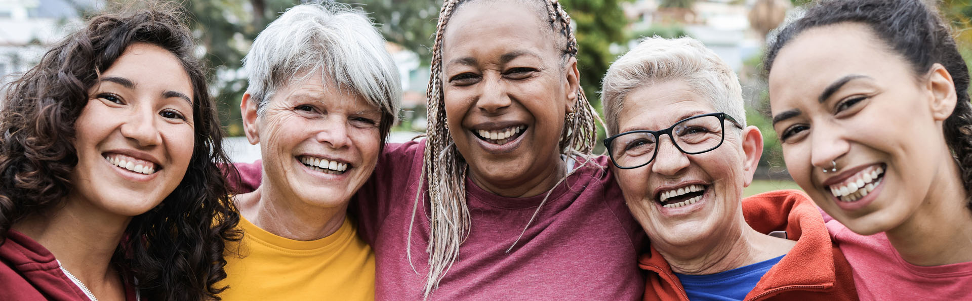 women standing in a group hugging