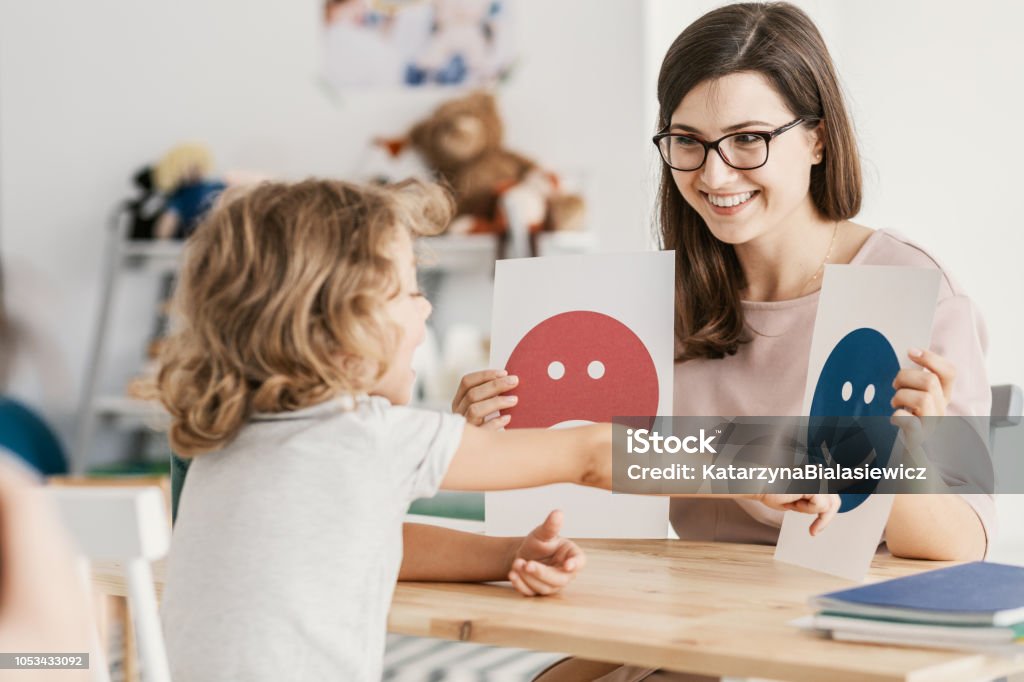 A school counselor working with a young child.