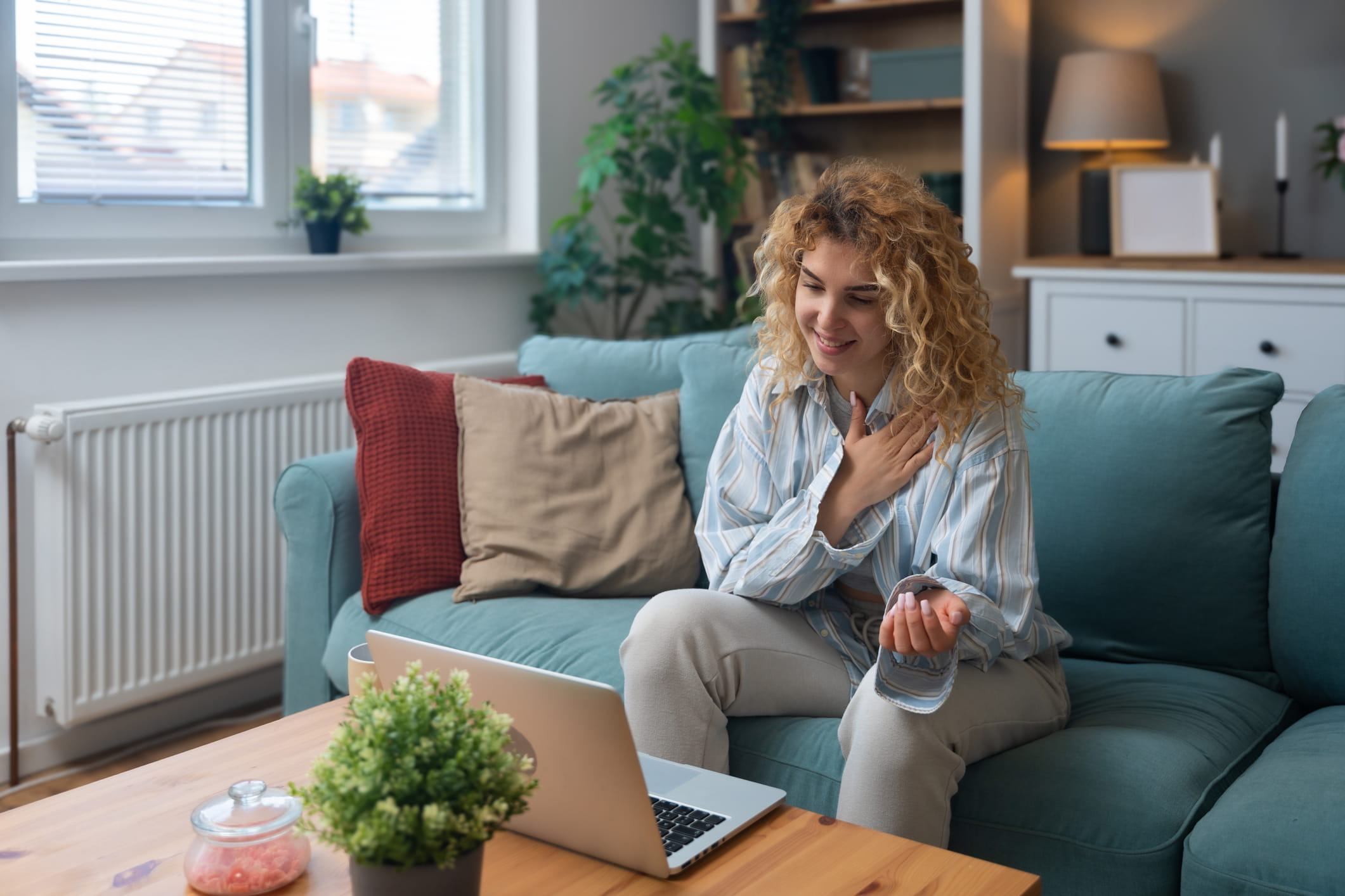 Young woman using a laptop to participate in a remote therapy session