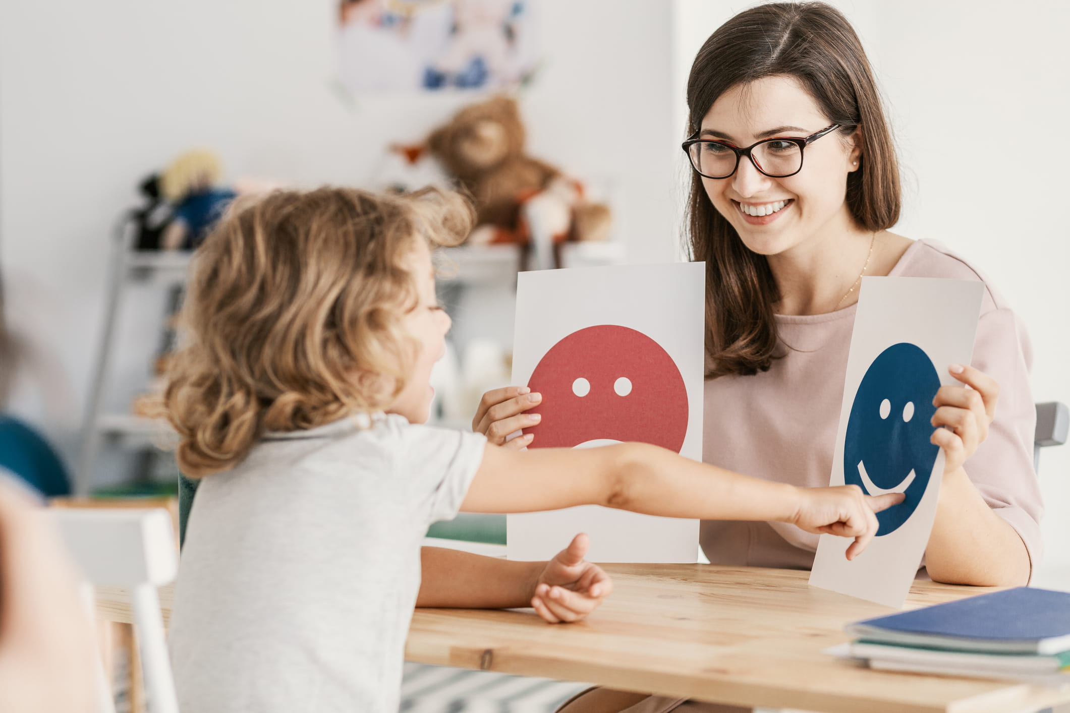 A school counselor working with a young child.