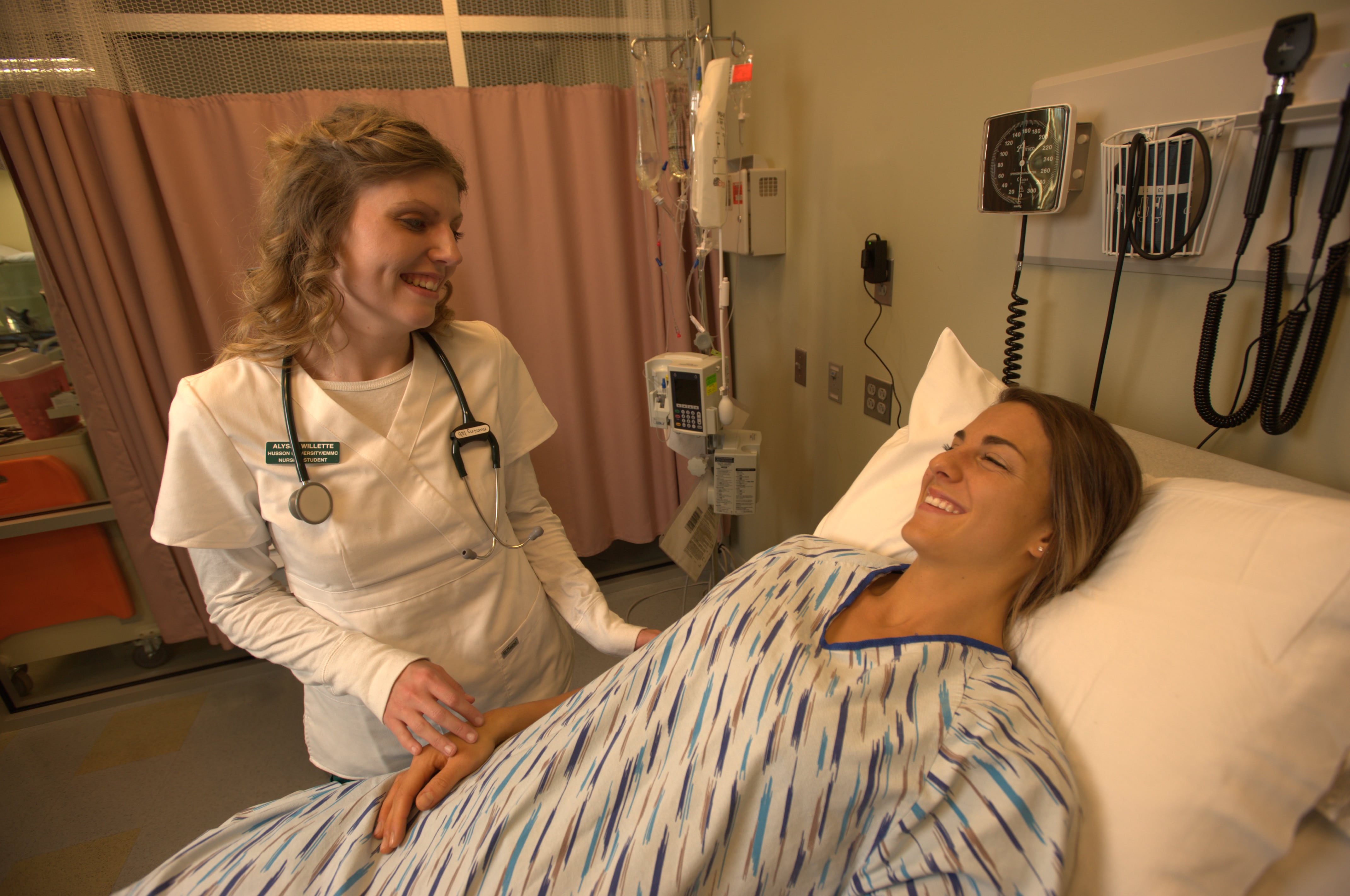 nurse standing next to patient