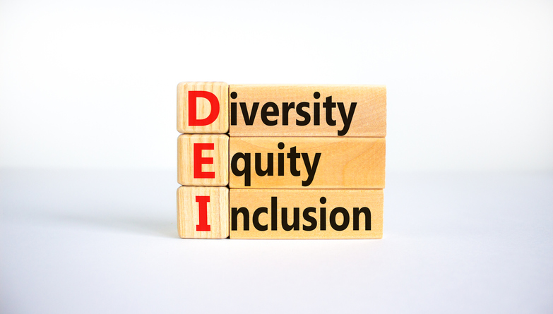 a stack of wooden blocks with the words diversity, equity and inclusion on them