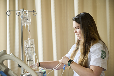 nurse checking an IV