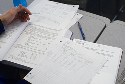 A student working on accounting homework for an MBA class