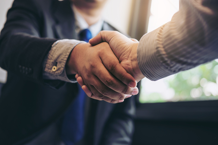 two business people shaking hands