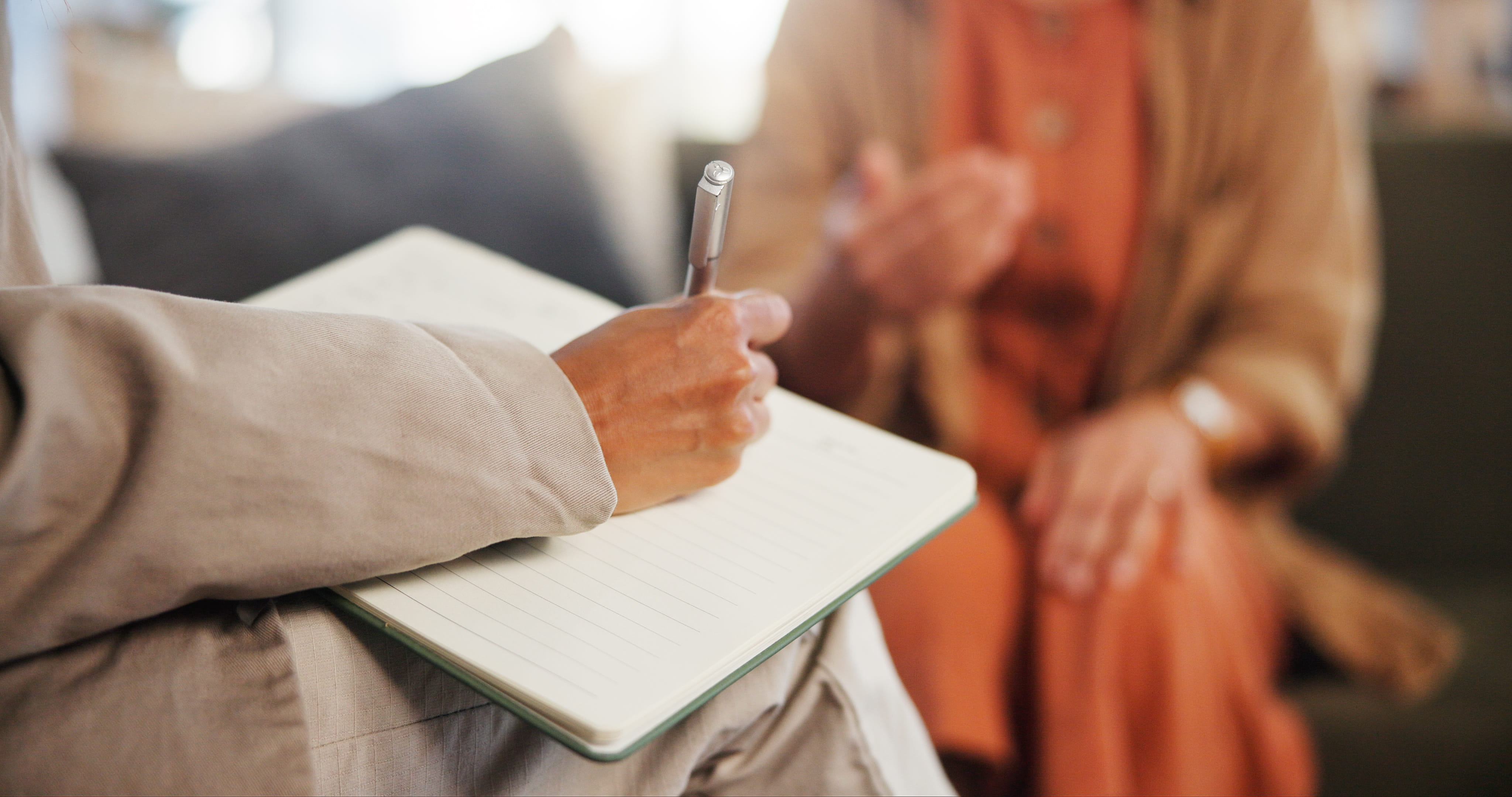Close up of therapist's hands during a counseling session.