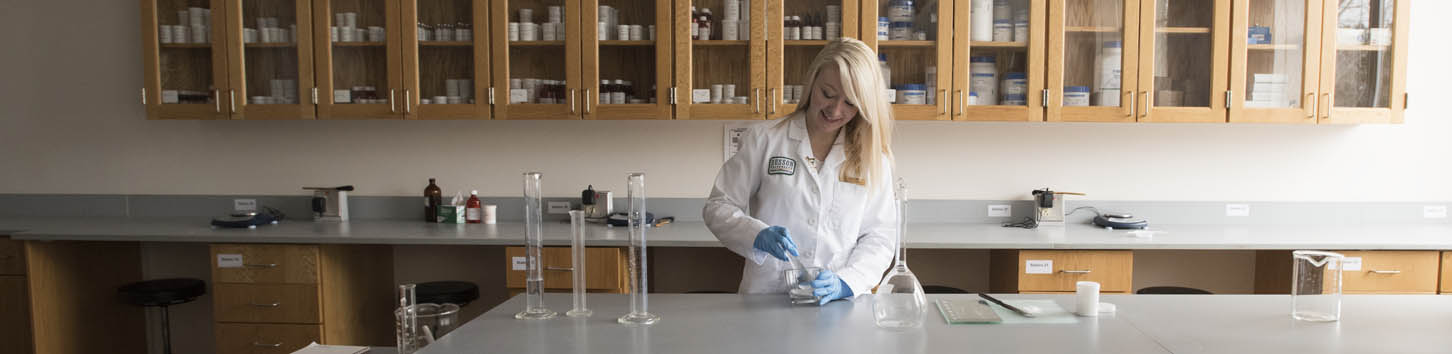 Student working in the compounding lab at Husson University