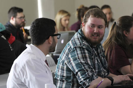 Pharmacy students listening to lecture in a classroom