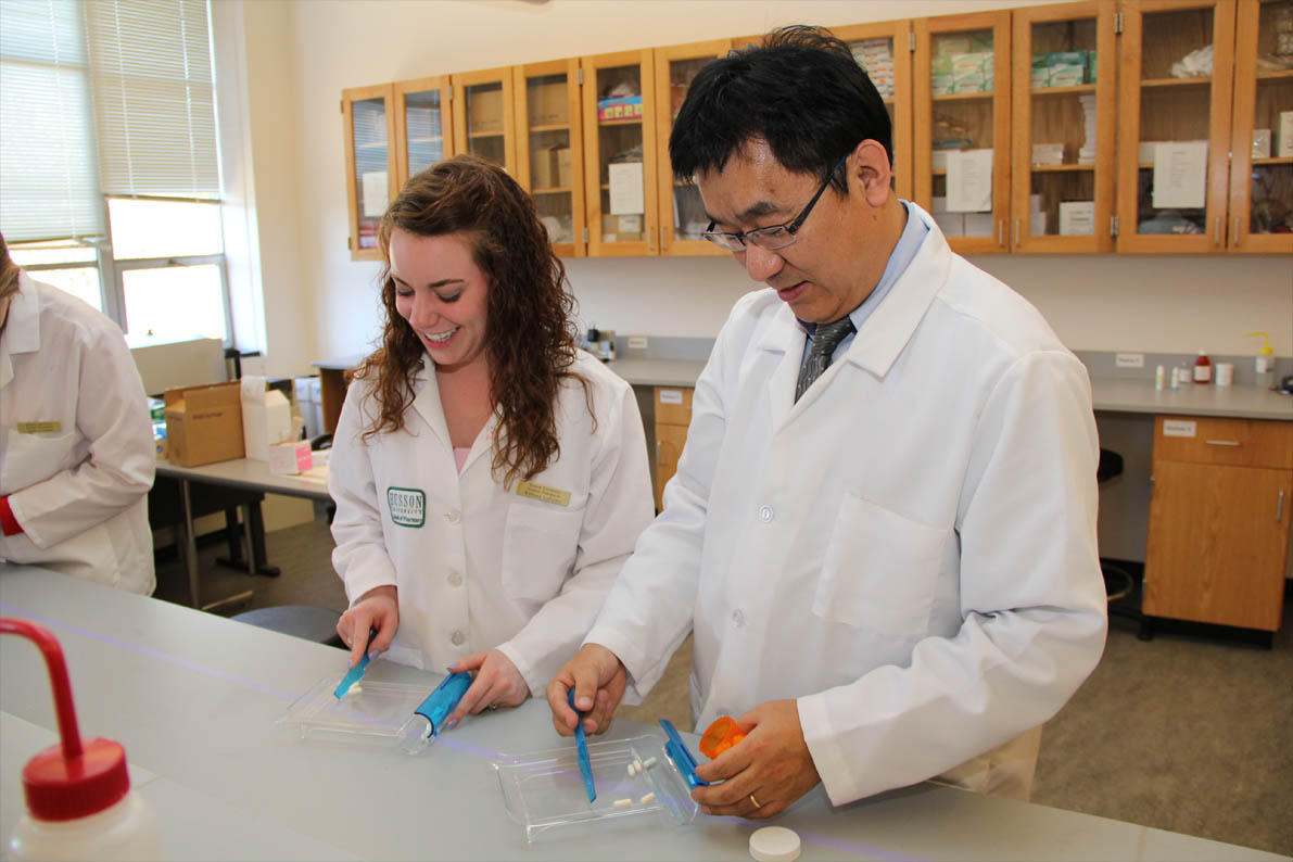Students and faculty work in the compounding lab