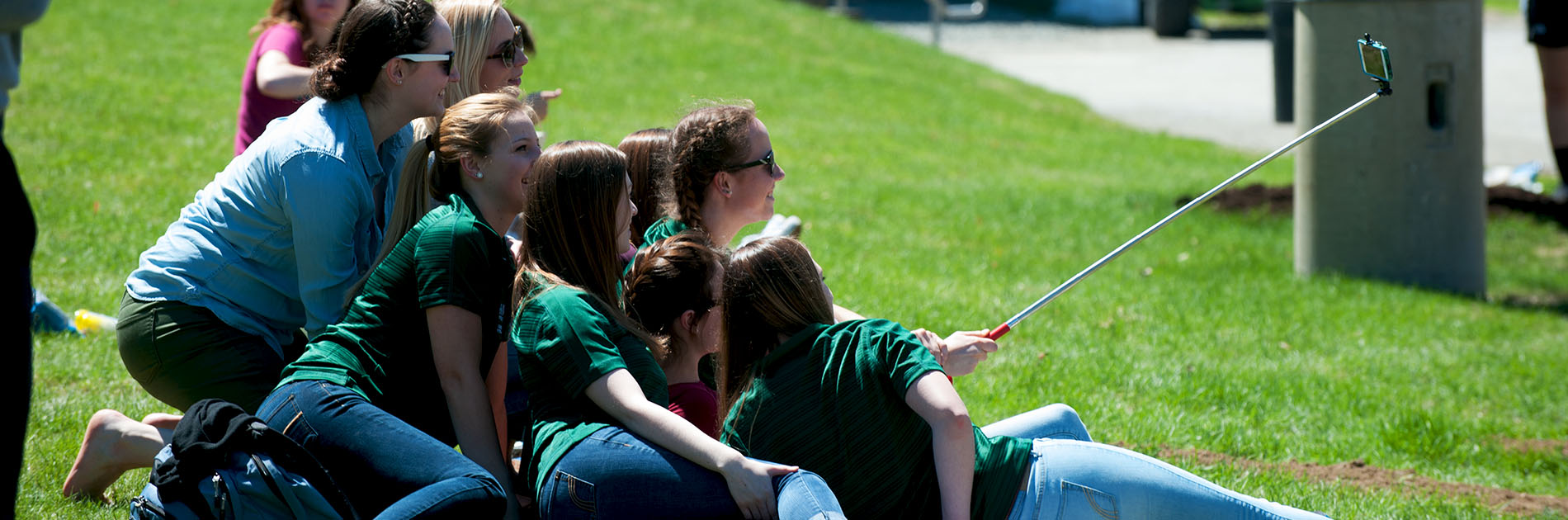 students taking a picture on camera