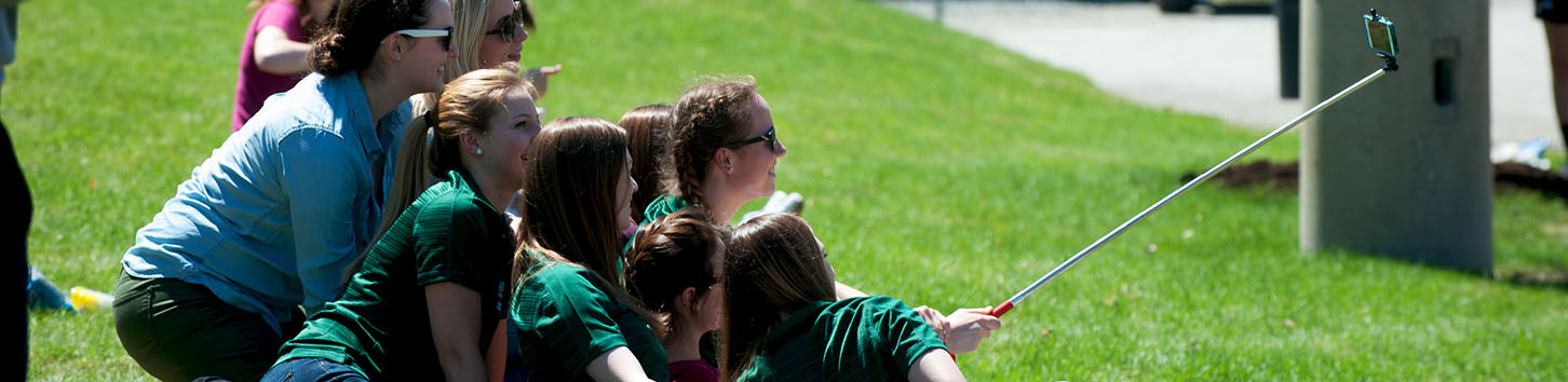 Students taking pictures on campus