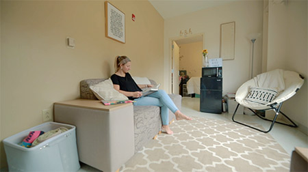 Student reading in the Darling Living and Learning Center