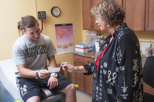 nurse helping student