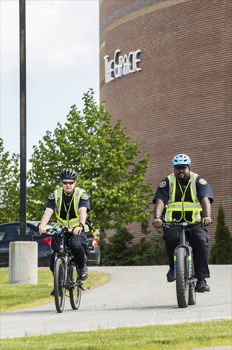 Safety and Security oficers riding bikes on campus