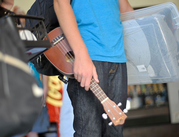 Student holding a musical instrument