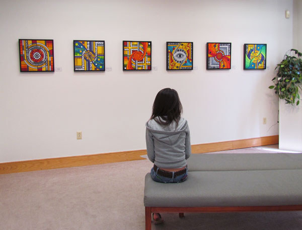 A student contemplating art in the White Gallery