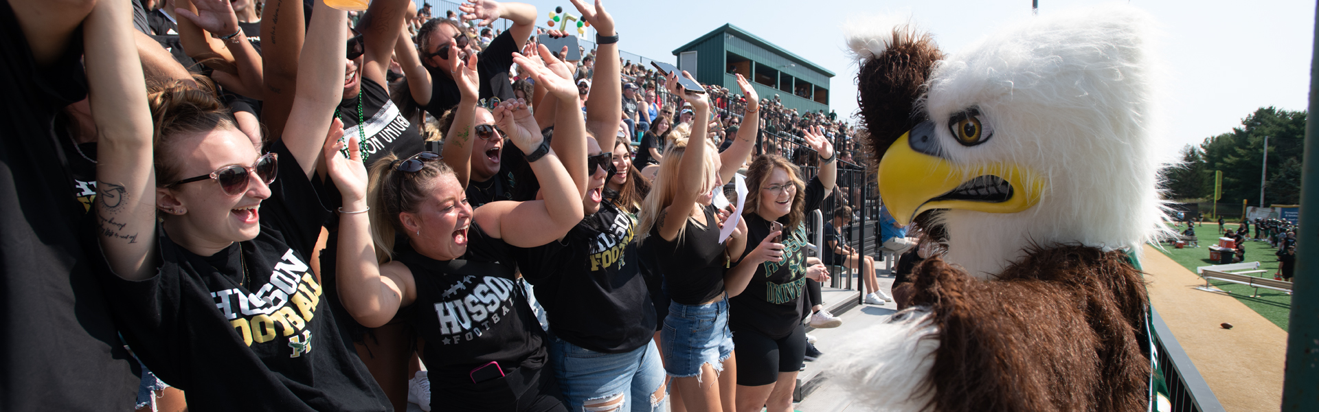 Baldwin hangs out with students at a football game